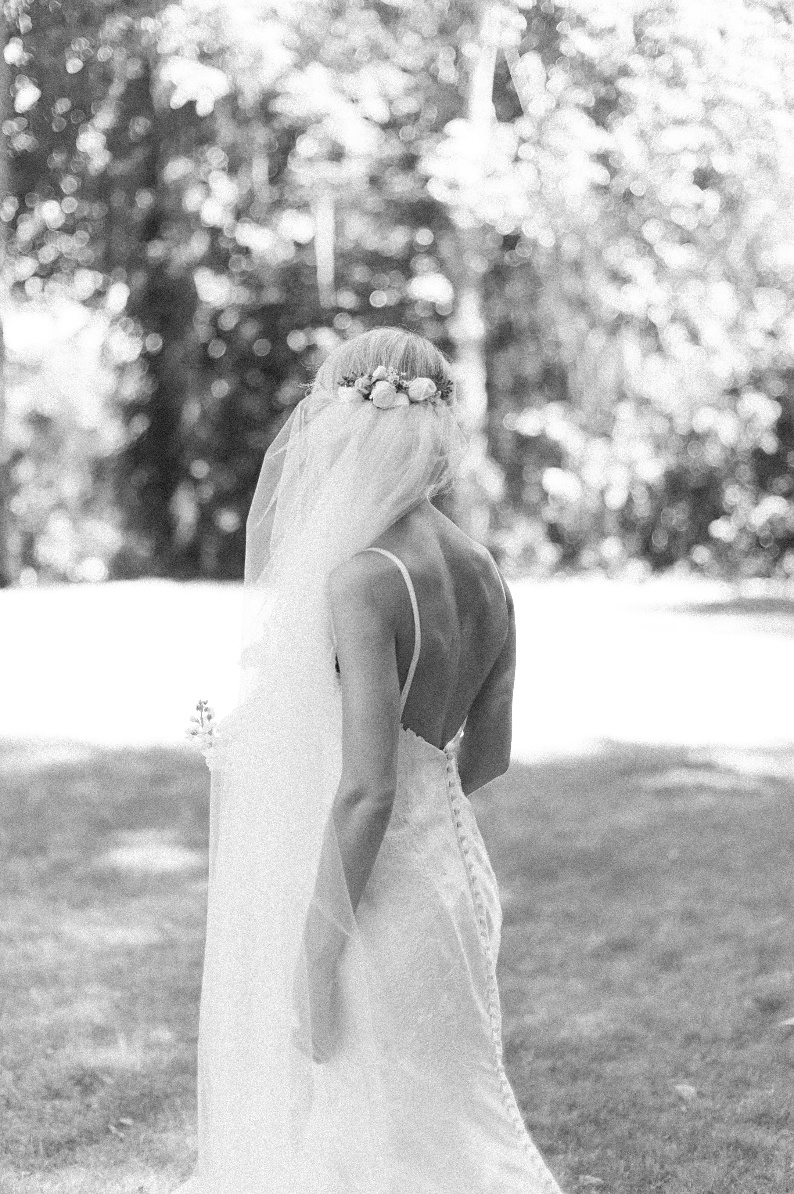 Another image of the back of wedding dress and updo in film photo edit consisting of iIlford black and white for a wedding in Selma, AL