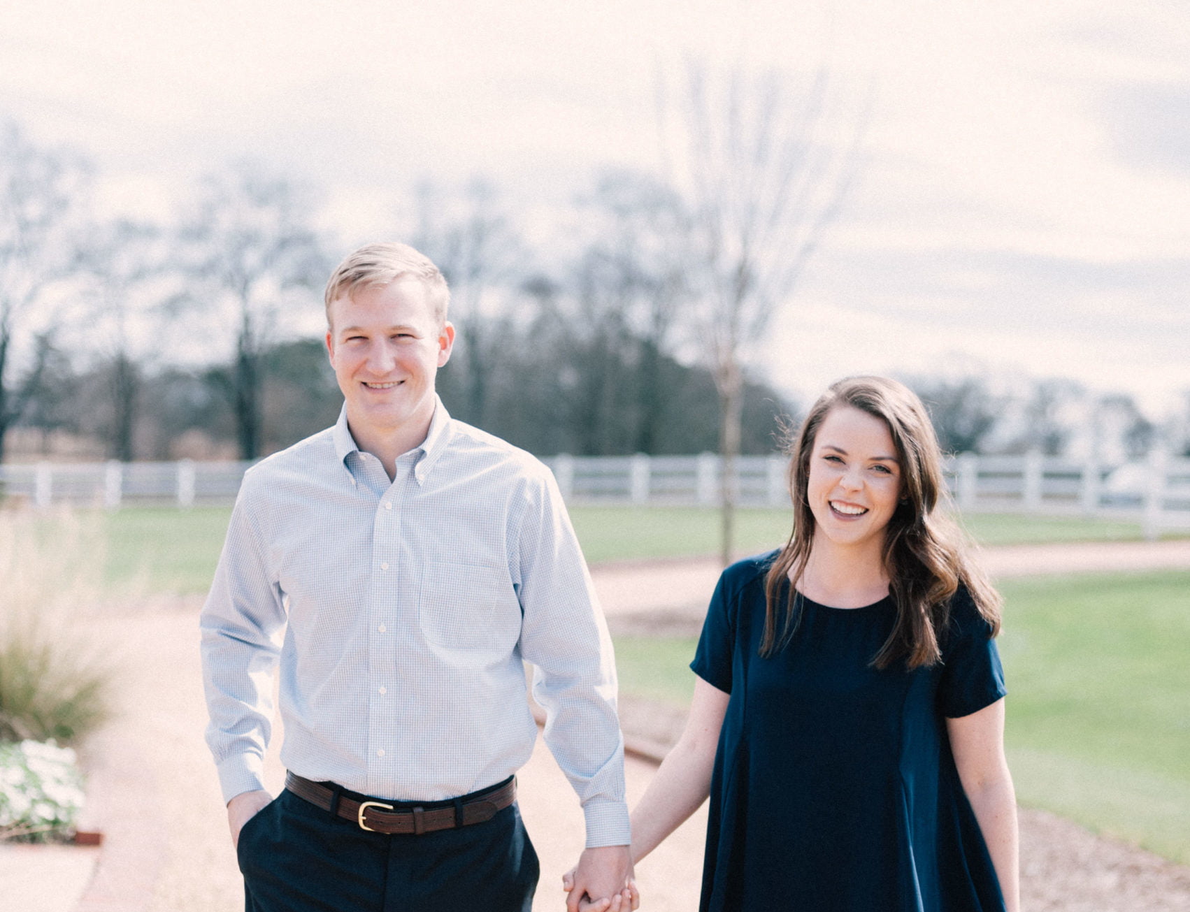 Sweet smiling photo of engaged couple at their session at Hamilton Place Pursell Farms