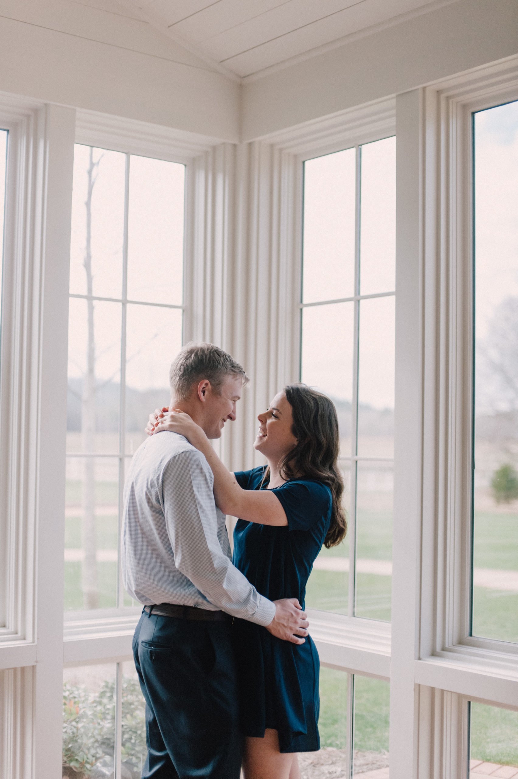 Engagement photos inside clubhouse at Hamilton Place Pursell Farms 