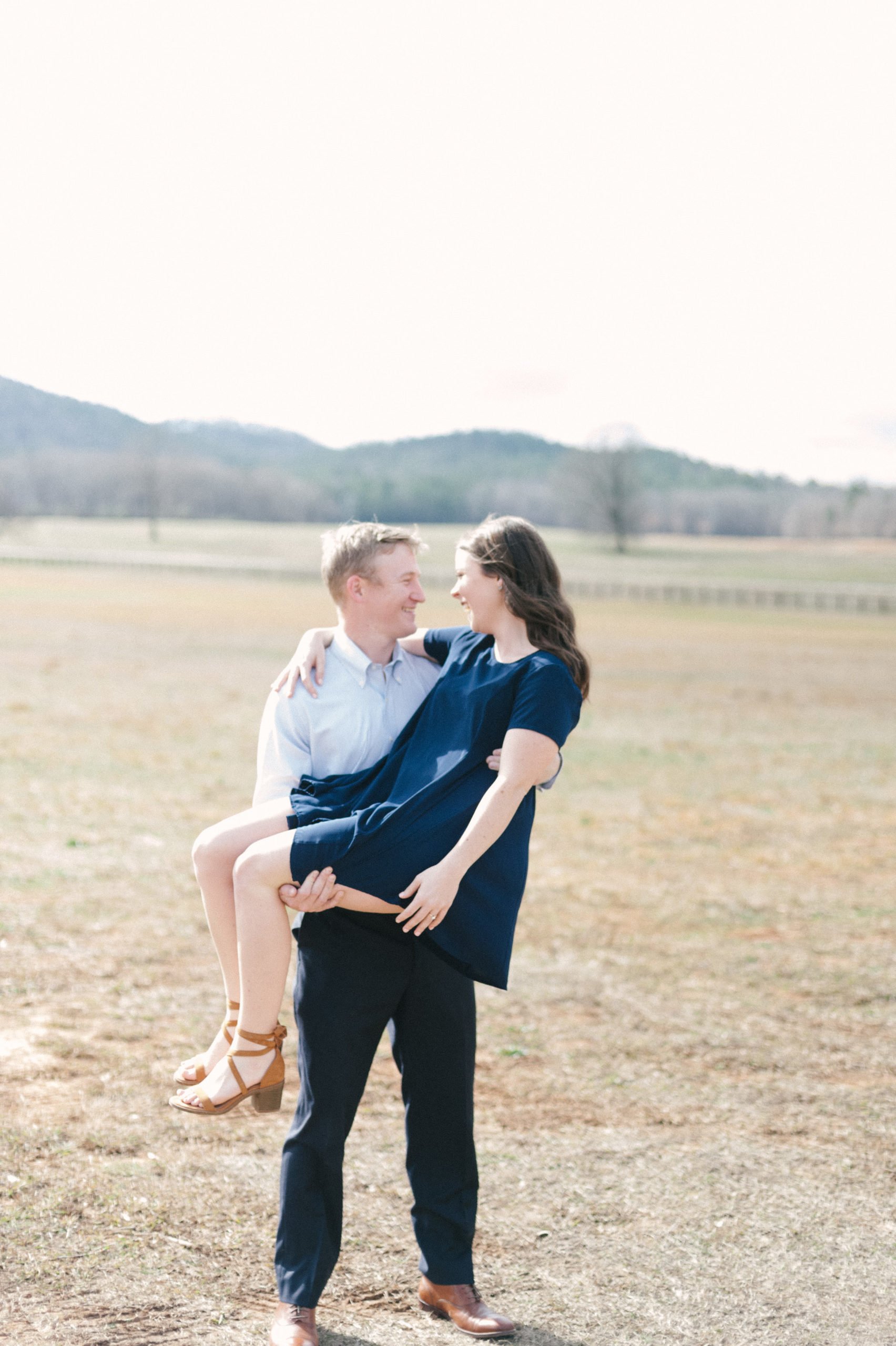 Truly the SWEETEST film photo aesthetic engagement session in the refreshing rural field at Pursell Farms wedding venue
