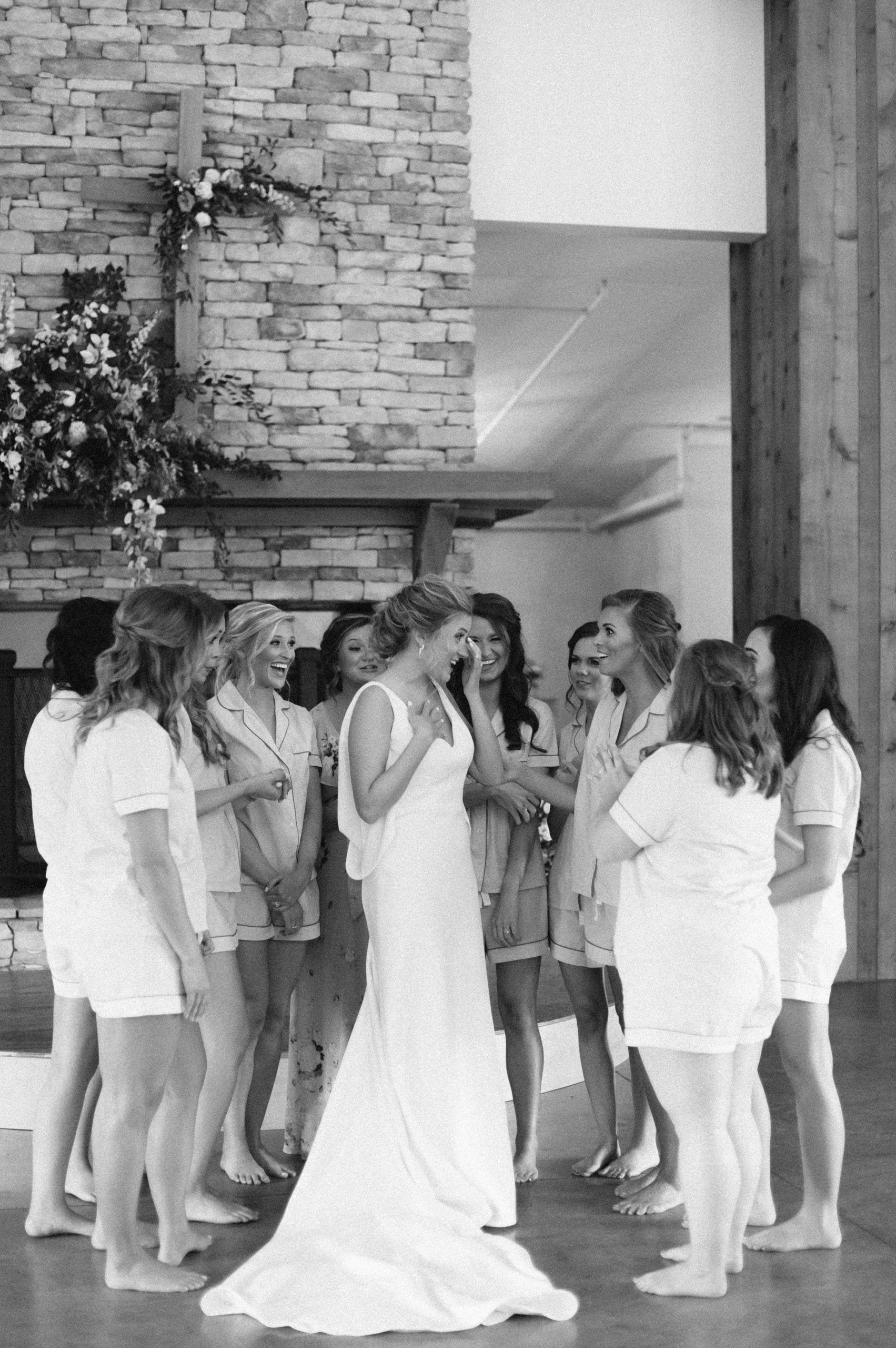 Bride talking with bridesmaids before Hoover AL wedding by Olivia Joy Photography