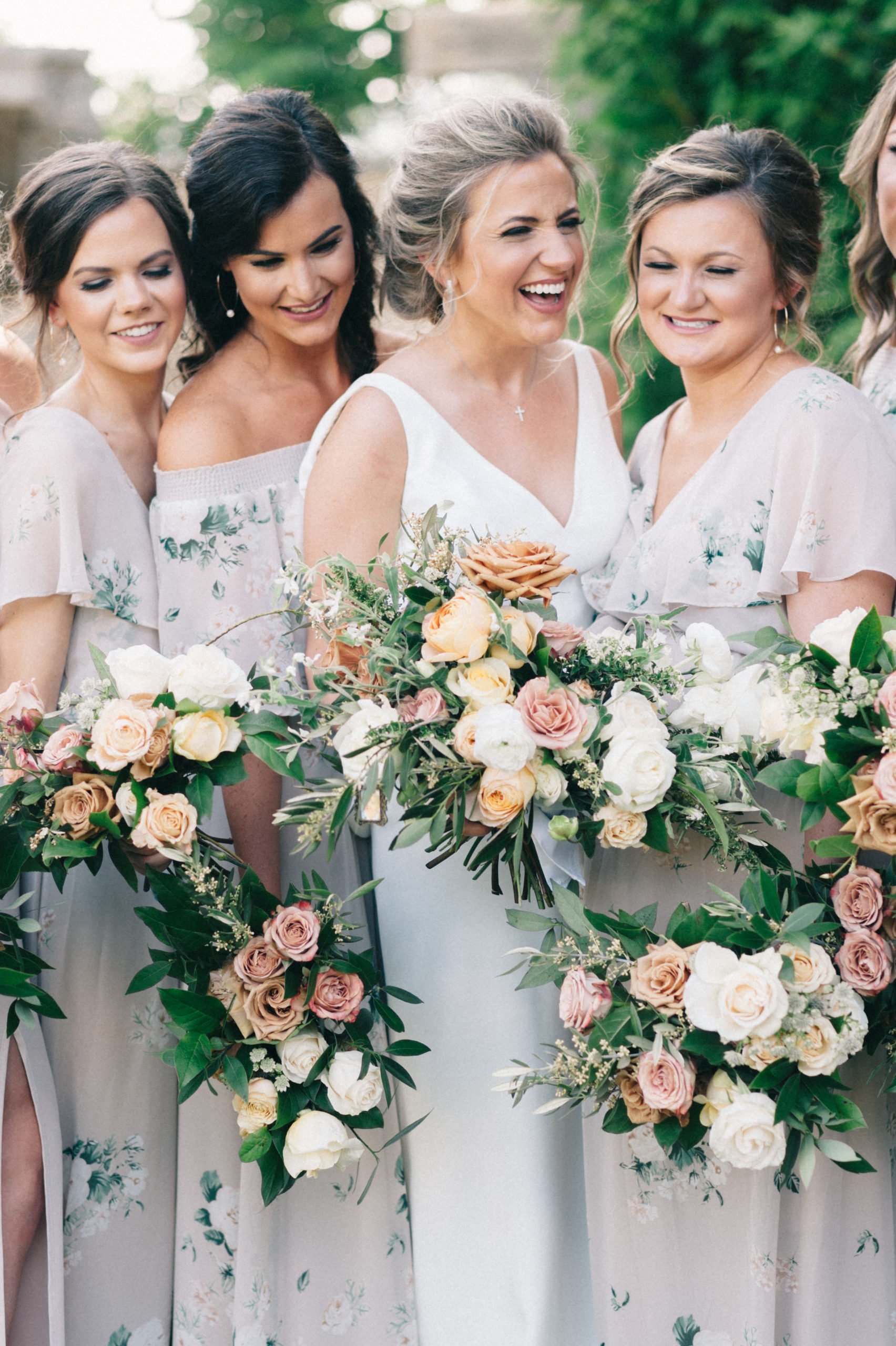 Bride and bridesmaids with bouquets at Park Crest Event Facility