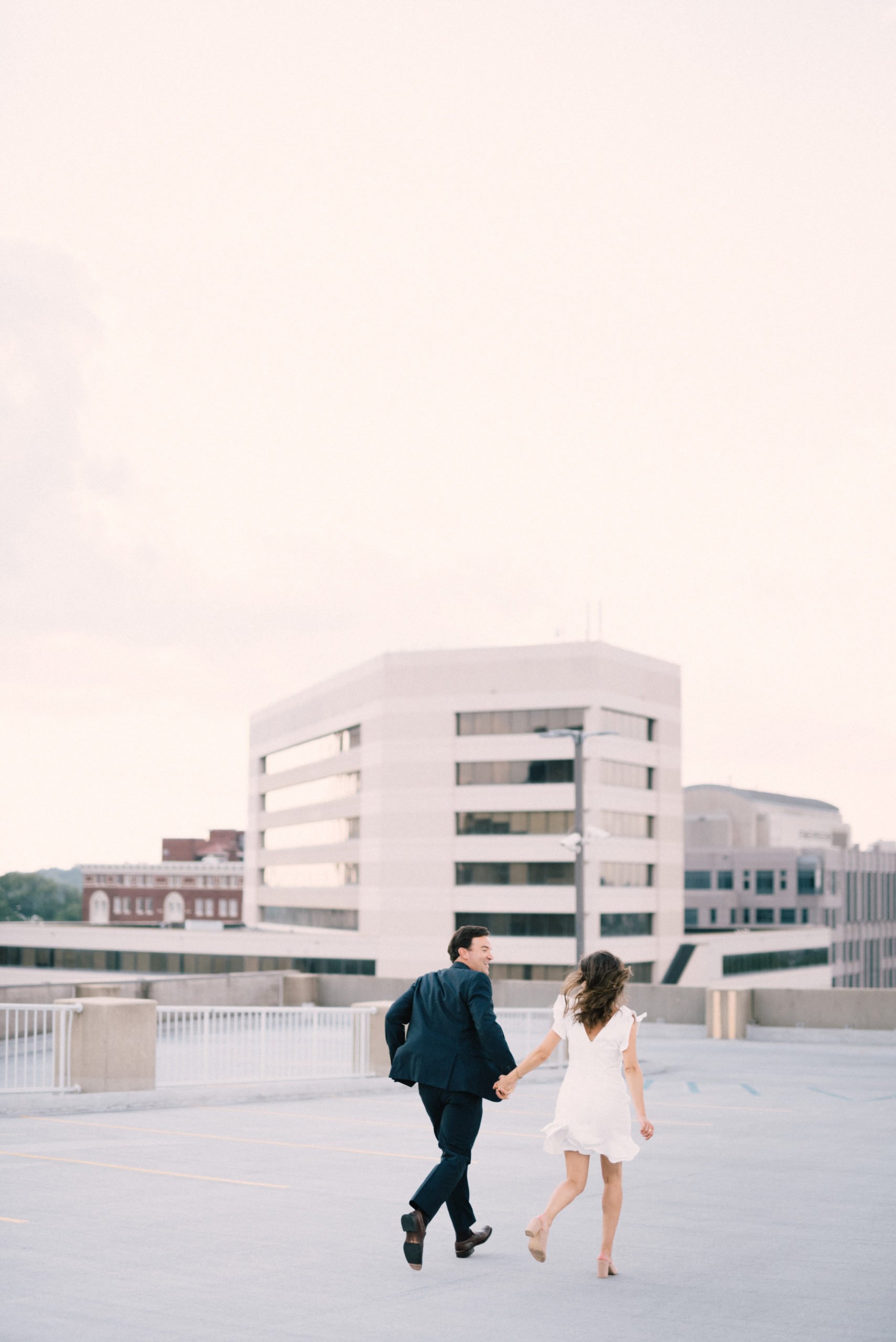 Creative engagement session on rooftop in downtown Birmingham AL