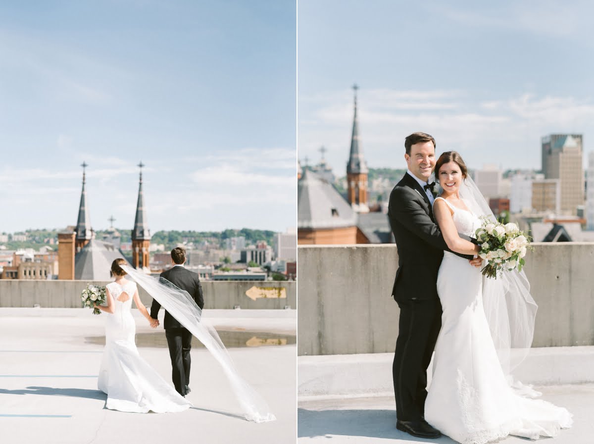 St Paul's Cathedral in background of Birmingham, AL rooftop married couple photos