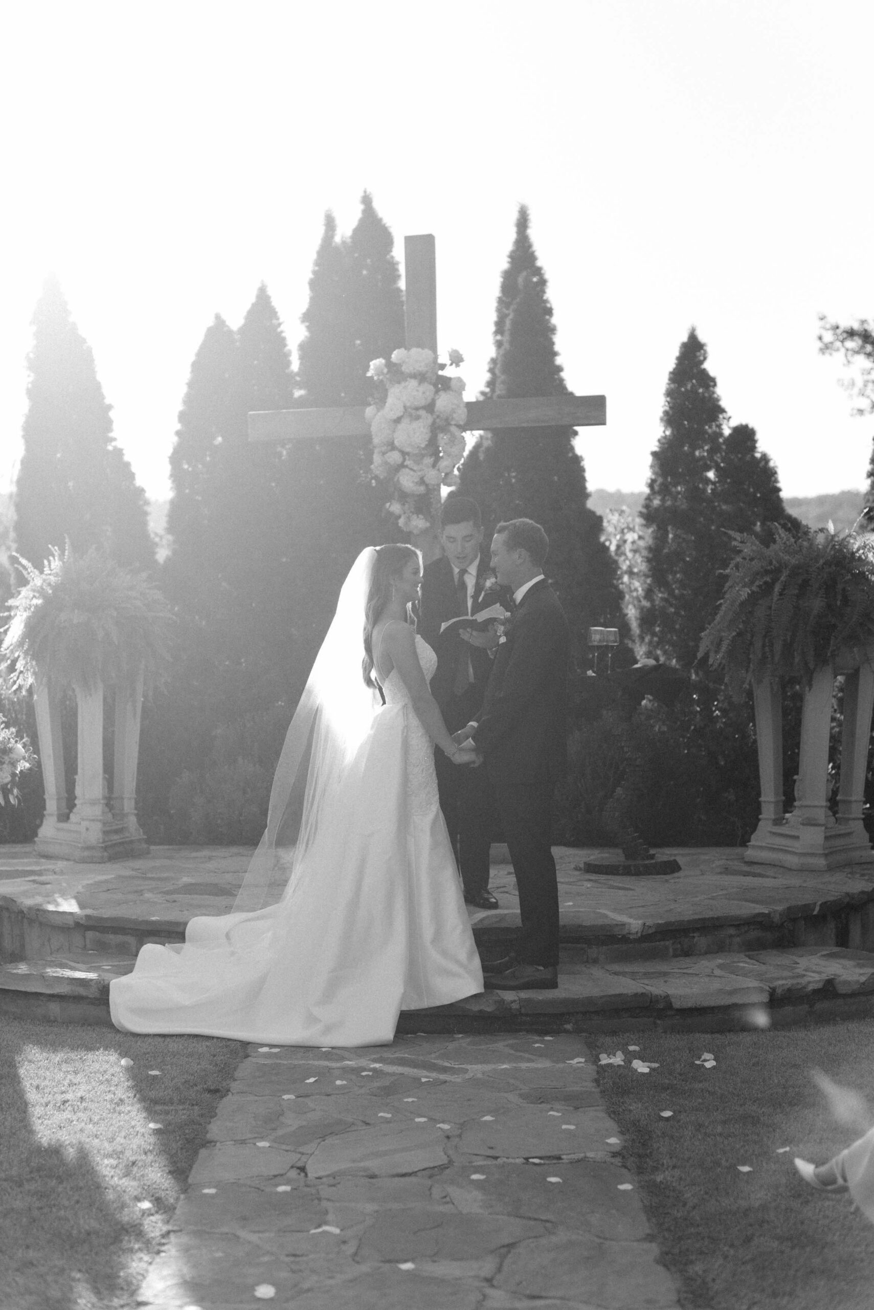 Emotion film edit image of a couple during their ceremony exchanging wedding vows, black and white photo by Olivia Joy Photography at Park Crest Events wedding venue in Hoover, AL