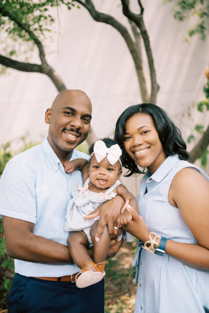 A perfect happy family portrait outside of the Birmingham Art Museum courtyard in Alabama